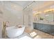 A modern bathroom features marble and glass at 571 Lyttleton Dr, Charlotte, NC 28211