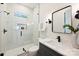 Modern bathroom with walk-in shower, new fixtures and sleek vanity at 571 Lyttleton Dr, Charlotte, NC 28211