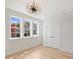 Bright bedroom featuring hardwood floors, double door closet and three large windows at 571 Lyttleton Dr, Charlotte, NC 28211