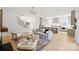 Bright and spacious living room with fireplace, hardwood floors and a view into the kitchen at 571 Lyttleton Dr, Charlotte, NC 28211