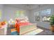 Bright bedroom with sunny windows, a cozy bed, and colorful artwork, creating a cheerful atmosphere at 310 Foster Ln, Albemarle, NC 28001