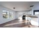 The bright kitchen features white cabinetry and ample counter space, perfect for cooking and entertaining at 310 Foster Ln, Albemarle, NC 28001