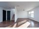 Spacious living room with luxury vinyl plank flooring, a staircase, and lots of natural light at 310 Foster Ln, Albemarle, NC 28001