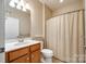 Bright bathroom with single vanity and shower featuring neutral colors at 4006 Trinity Ct, Indian Land, SC 29707