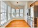 Bright dining area featuring hardwood floors, ample natural light, and a stainless steel refrigerator at 4006 Trinity Ct, Indian Land, SC 29707