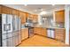 Open kitchen featuring stainless steel appliances, granite countertops, and wood floors at 4006 Trinity Ct, Indian Land, SC 29707