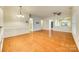 Open living area with hardwood floors, elegant lighting, and decorative wainscoting detail at 4006 Trinity Ct, Indian Land, SC 29707