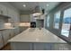 Bright modern kitchen featuring an island, pendant lighting, stainless steel appliances, and white cabinets at 4356 Morning Mist Dr # 22, Sherrills Ford, NC 28673