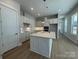 Bright kitchen boasts an island, pendant lighting, stainless steel appliances, and white cabinets at 4356 Morning Mist Dr # 22, Sherrills Ford, NC 28673