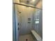 Modern shower with a built-in bench, niche, and neutral tiling at 4356 Morning Mist Dr # 22, Sherrills Ford, NC 28673