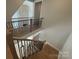 Modern staircase featuring wooden steps and black metal railings, connecting different levels of the home at 4356 Morning Mist Dr # 22, Sherrills Ford, NC 28673