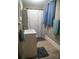 Updated bathroom features a tub shower, vanity, and gray flooring at 703 Margate Ave, Kannapolis, NC 28081