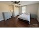 Bedroom with hardwood floors, queen bed, and dresser at 703 Margate Ave, Kannapolis, NC 28081