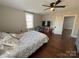 Bedroom with hardwood floors, queen bed, and ceiling fan at 703 Margate Ave, Kannapolis, NC 28081