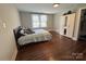 Comfortable bedroom with hardwood floors, double window, and built-in wardrobe at 703 Margate Ave, Kannapolis, NC 28081