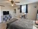 Bright bedroom with hardwood floors, ceiling fan, and barn door at 703 Margate Ave, Kannapolis, NC 28081