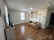 Living room with hardwood floors, couch, and TV at 703 Margate Ave, Kannapolis, NC 28081