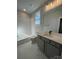 Bathroom with white subway tile, a vanity with quartz countertop, and bathtub at 714 Barrel Aly, Fort Mill, SC 29715