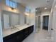 Spa-like bathroom with double vanity, quartz countertop, and frameless shower at 714 Barrel Aly, Fort Mill, SC 29715