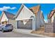 A two car garage features gray siding and a gray garage door with clear blue skies overhead at 714 Barrel Aly, Fort Mill, SC 29715