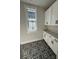 Laundry room with white cabinets and patterned floor tile at 714 Barrel Aly, Fort Mill, SC 29715