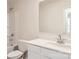 Well-lit bathroom with single sink, white vanity, and a shower-tub combination with white tile surround at 117 Dorian Pl, Troutman, NC 28166