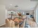 Open concept dining area with kitchen views and hardwood floors at 117 Dorian Pl, Troutman, NC 28166