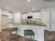 Kitchen island with granite countertop and seating for four at 117 Dorian Pl, Troutman, NC 28166