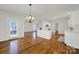 Bright dining room with hardwood floors and a chandelier at 1360 Barnett Woods, Fort Mill, SC 29708