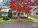 Two-story house with wrap-around porch and autumn foliage at 1360 Barnett Woods, Fort Mill, SC 29708