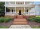 Brick steps leading to charming front porch with mums at 1360 Barnett Woods, Fort Mill, SC 29708