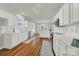 Modern kitchen with white cabinets, quartz countertops, and hardwood floors at 1360 Barnett Woods, Fort Mill, SC 29708