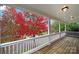 Wooden porch overlooking a tree with red leaves at 1360 Barnett Woods, Fort Mill, SC 29708