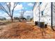 The exterior side and backyard of this new home feature a new patio and unfinished lot at 150 Roxie Ln, Belmont, NC 28012