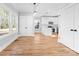 Bright dining area open to the kitchen with stylish pendant lights and large windows at 150 Roxie Ln, Belmont, NC 28012