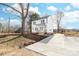 Charming new two-story white home with covered porch and new concrete driveway at 150 Roxie Ln, Belmont, NC 28012