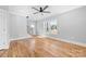 Living room features include hardwood floors, a ceiling fan and stair access at 150 Roxie Ln, Belmont, NC 28012