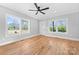 Spacious living room featuring hardwood floors, modern ceiling fan, and natural light at 150 Roxie Ln, Belmont, NC 28012