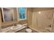 Bathroom featuring a vanity with solid surface counters and shower-tub combo at 1062 Full Count Ln, Lancaster, SC 29720