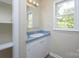 Bathroom featuring a vanity with solid surface counters and natural light at 1062 Full Count Ln, Lancaster, SC 29720