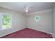 A bedroom featuring two different style windows and a ceiling fan at 1062 Full Count Ln, Lancaster, SC 29720