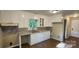 Kitchen with white cabinetry, solid surface countertops, and stainless steel sink at 1062 Full Count Ln, Lancaster, SC 29720