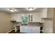 Bright kitchen featuring white cabinetry, solid surface countertops, and natural light at 1062 Full Count Ln, Lancaster, SC 29720