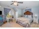 Serene bedroom featuring a cushioned bed, soft carpeting, and well-lit windows at 1136 Preakness Nw Ct, Concord, NC 28027