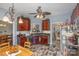 Kitchen featuring wood cabinets, stainless steel appliances, a breakfast table, and a view into an adjoining room, filled with natural light at 1136 Preakness Nw Ct, Concord, NC 28027