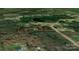 An overhead view shows the property surrounded by lush trees and greenery at 1216 Stallion Ln, Lancaster, SC 29720
