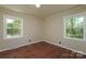 Bright bedroom featuring hardwood floors and two windows offering ample natural light at 1216 Stallion Ln, Lancaster, SC 29720