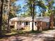 Charming brick home nestled among trees offers privacy and natural beauty at 1216 Stallion Ln, Lancaster, SC 29720