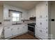 Kitchen featuring white cabinets, wood-look flooring and stainless steel oven at 1216 Stallion Ln, Lancaster, SC 29720
