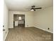 Sunlit living room with open floor plan and modern ceiling fan at 1216 Stallion Ln, Lancaster, SC 29720